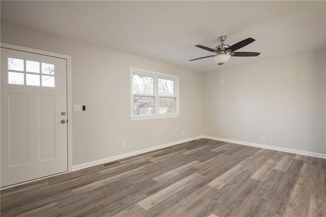 foyer with dark hardwood / wood-style flooring and ceiling fan