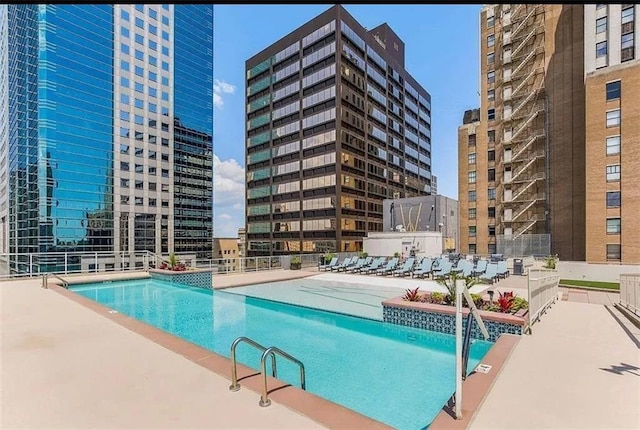 view of swimming pool with a patio area