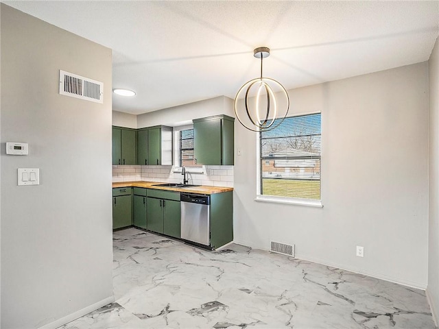 kitchen featuring decorative backsplash, wood counters, sink, dishwasher, and green cabinets