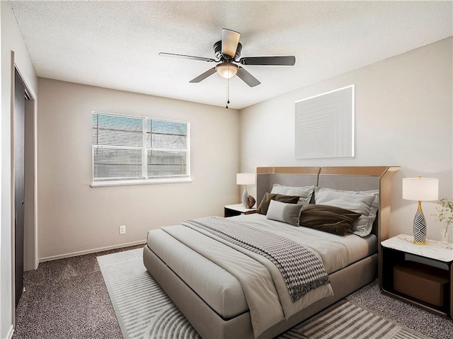 bedroom featuring carpet flooring, ceiling fan, and a textured ceiling