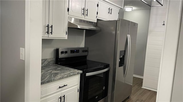 kitchen with a textured ceiling, light stone counters, appliances with stainless steel finishes, dark hardwood / wood-style flooring, and white cabinetry