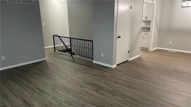 spare room featuring dark hardwood / wood-style floors