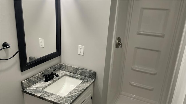 bathroom featuring vanity and walk in shower