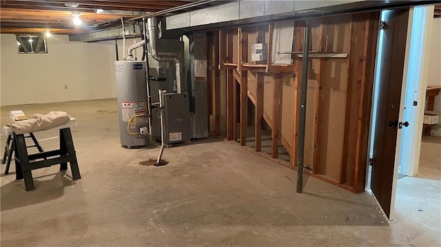 basement featuring heating unit and water heater