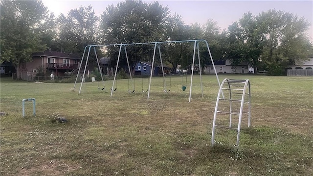 view of playground with a lawn