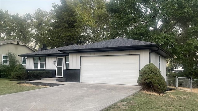 view of front facade with a front lawn and a garage