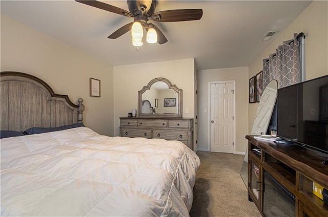 bedroom with ceiling fan and light colored carpet