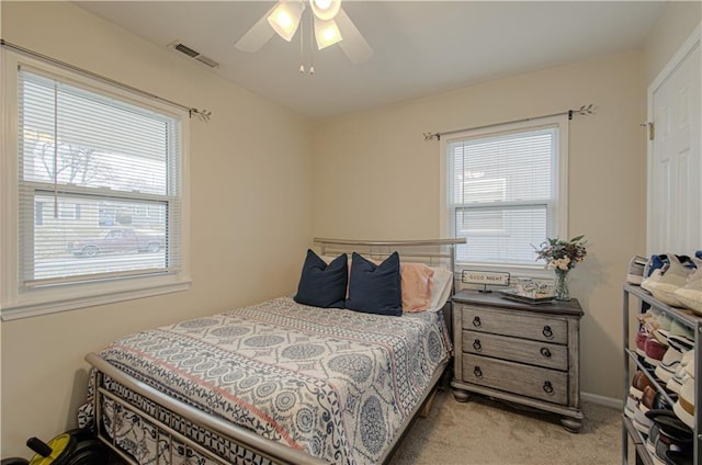 carpeted bedroom with ceiling fan