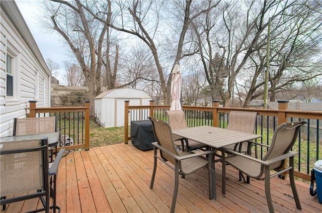 wooden deck featuring a shed