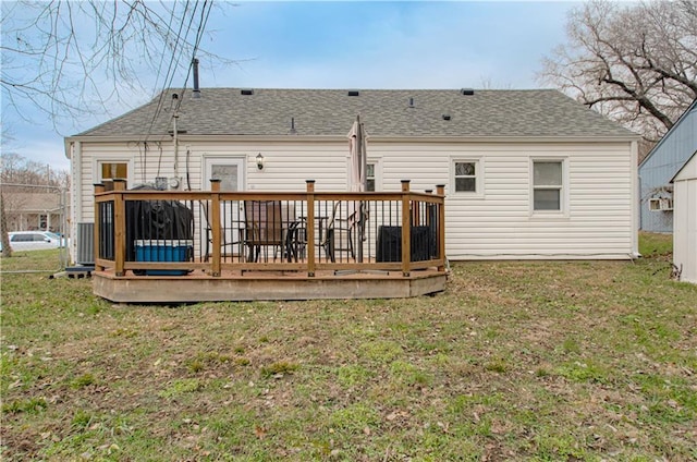 back of house with a yard and a wooden deck