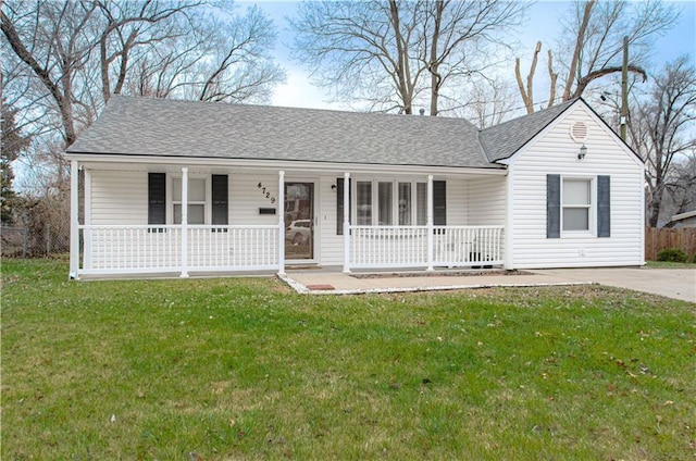 single story home with a front yard and covered porch