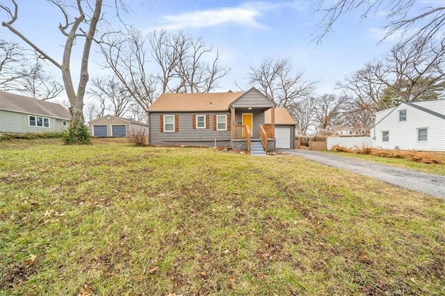 view of front of property with a garage and a front yard