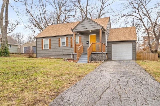 view of front of property with a garage and a front yard