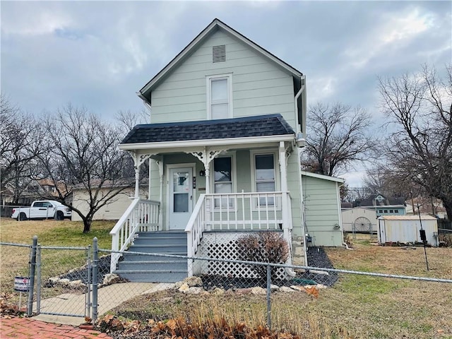 bungalow featuring a front yard and a porch