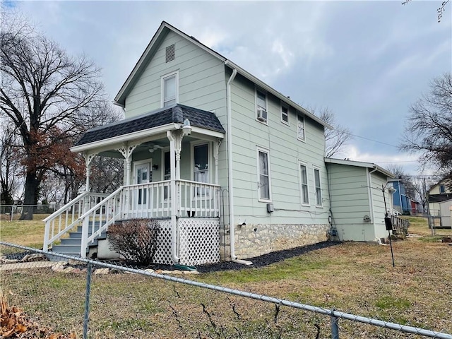 view of front of property with a front yard and a porch