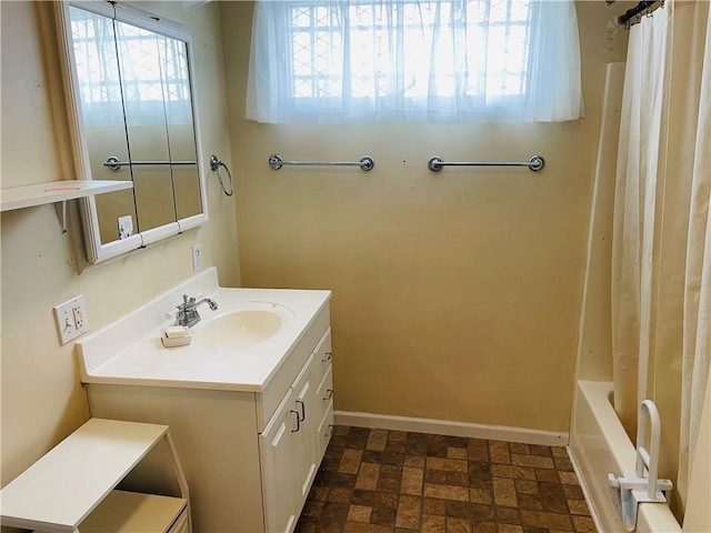 bathroom with shower / bath combination with curtain and vanity