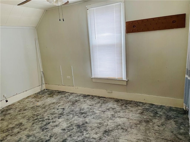 additional living space featuring ceiling fan, carpet floors, and vaulted ceiling