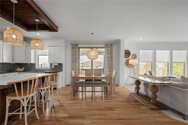 dining room with light wood finished floors, recessed lighting, and a healthy amount of sunlight