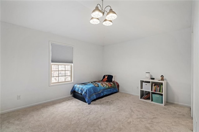 bedroom featuring carpet flooring, a notable chandelier, and baseboards