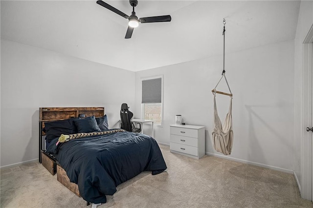 bedroom featuring baseboards, a ceiling fan, and light colored carpet