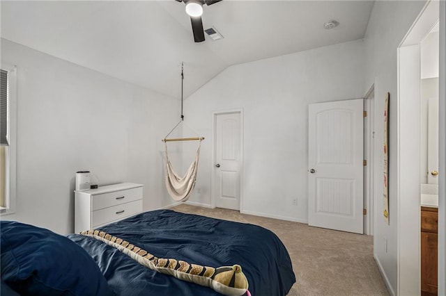 bedroom featuring lofted ceiling, baseboards, visible vents, and light colored carpet