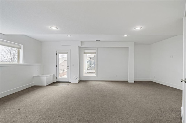 carpeted spare room with baseboards and recessed lighting