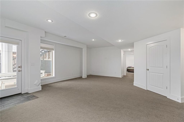 carpeted empty room with recessed lighting and baseboards