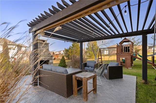 view of patio with an outdoor living space with a fireplace, a playground, and a pergola