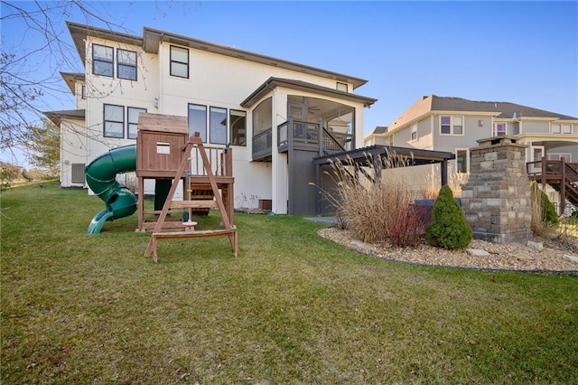 view of playground with a yard