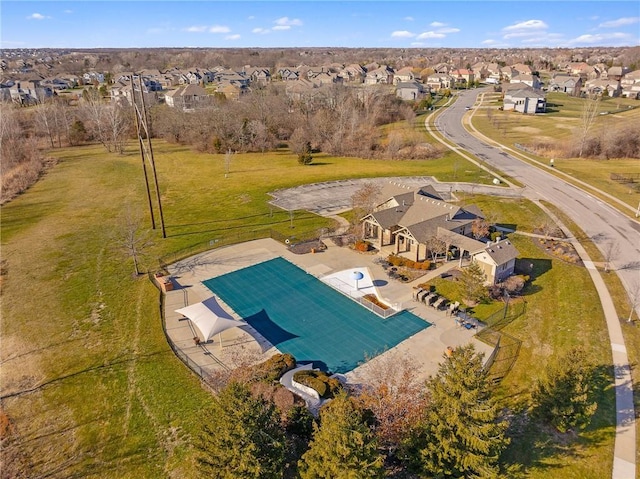 birds eye view of property with a residential view