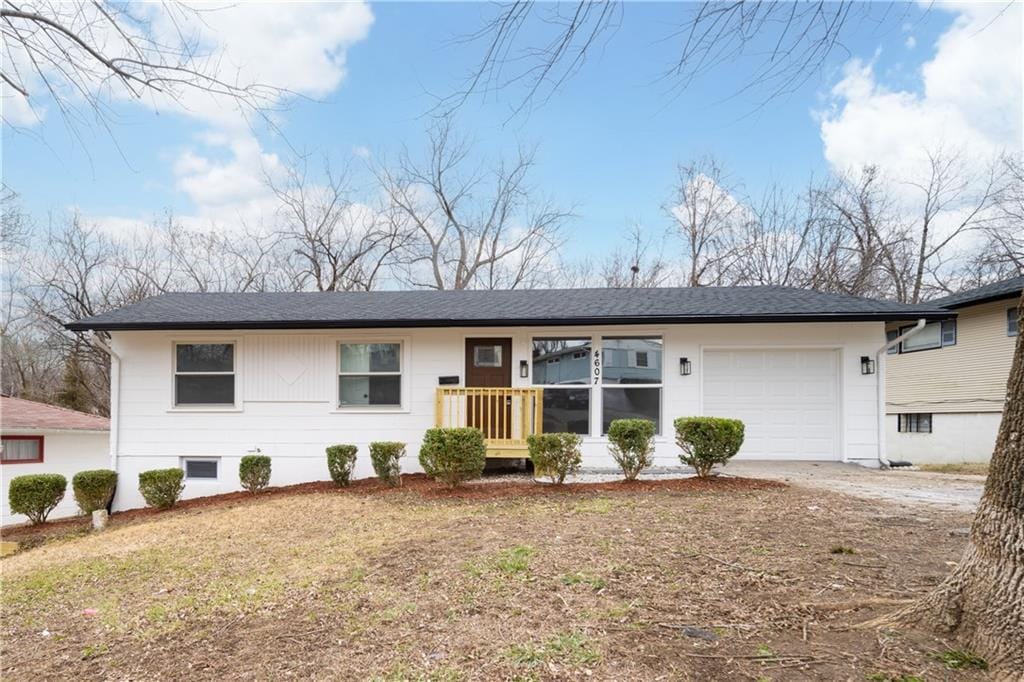 single story home featuring a garage