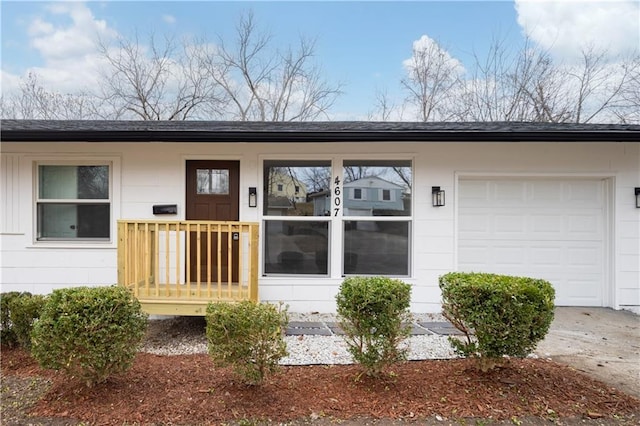 entrance to property featuring a garage