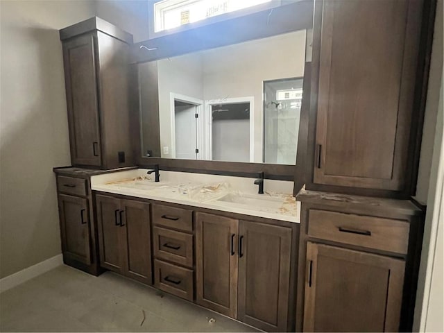 1708 SW Arbormist Dr, Lees Summit, MO 64082 - bathroom with double vanity and baseboards