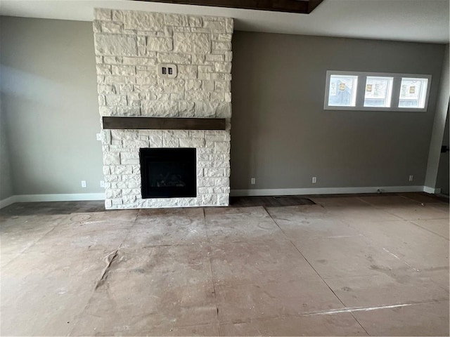 1708 SW Arbormist Dr, Lees Summit, MO 64082 - unfurnished living room featuring baseboards and a stone fireplace