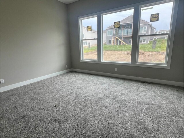 1708 SW Arbormist Dr, Lees Summit, MO 64082 - carpeted spare room featuring baseboards