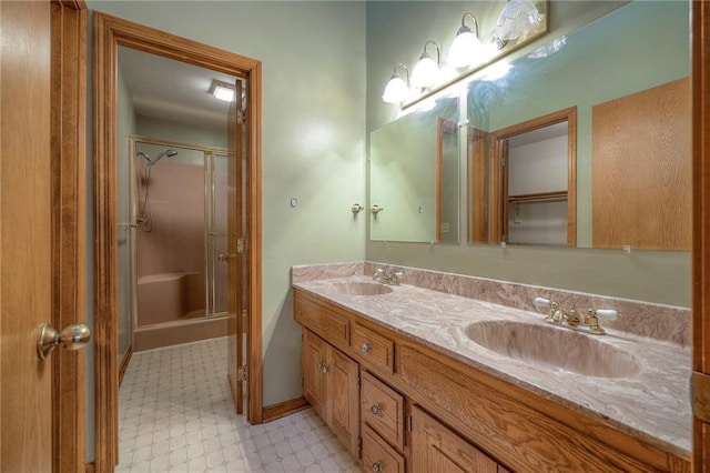 bathroom featuring vanity and a shower with door