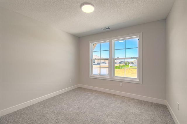 1712 SW Arbormist Dr, Lees Summit, MO 64082 - spare room with light carpet and a textured ceiling