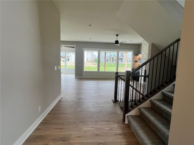1712 SW Arbormist Dr, Lees Summit, MO 64082 - hall with wood finished floors and stairway