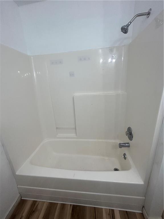 bathroom featuring shower / bath combination and wood-type flooring