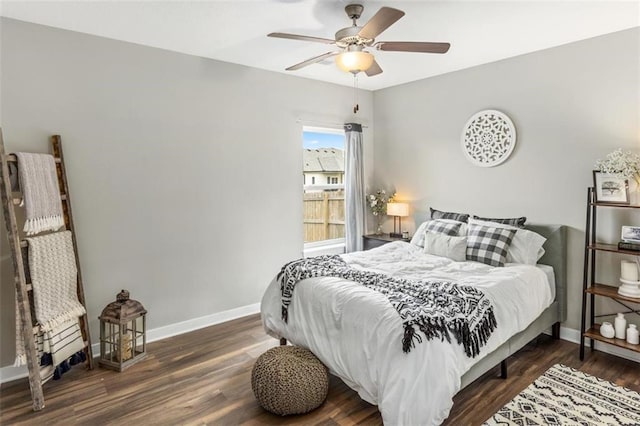 bedroom with ceiling fan and dark hardwood / wood-style flooring