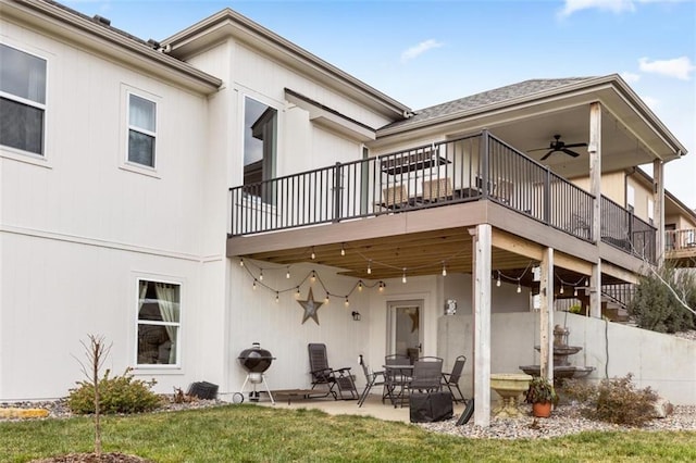 back of house with a yard, ceiling fan, and a patio