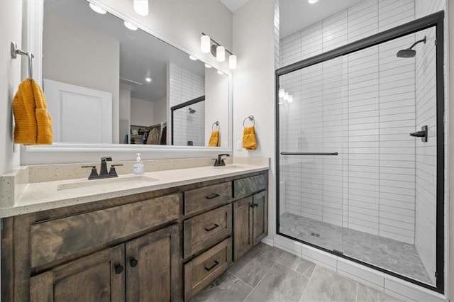 bathroom featuring vanity and a shower with shower door