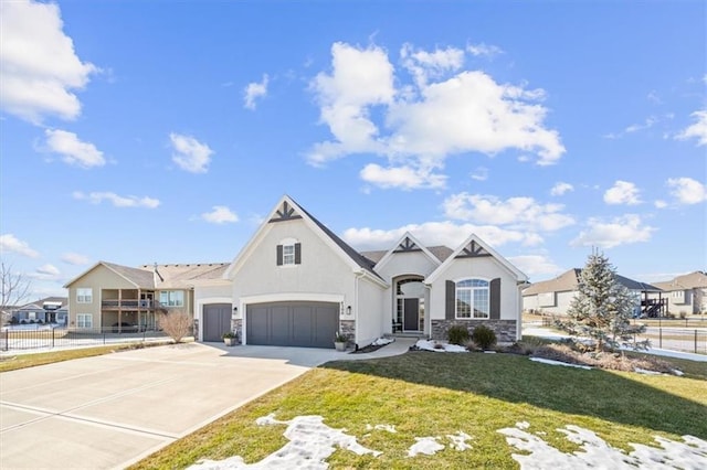 view of front of house with a garage and a front lawn