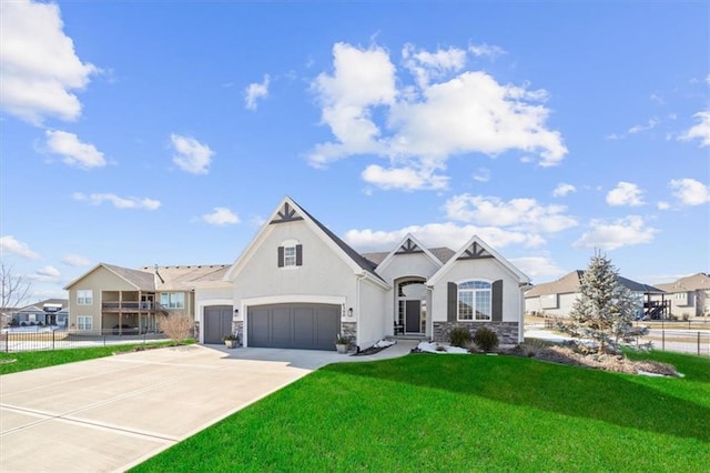 view of front of property featuring a garage and a front yard