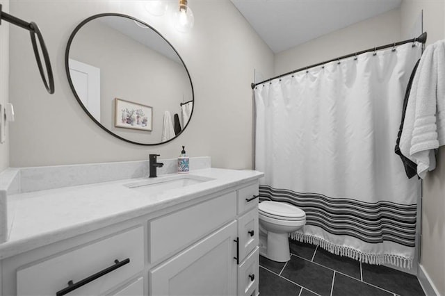 bathroom with tile patterned floors, toilet, and vanity