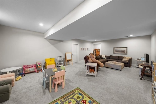 rec room with light colored carpet