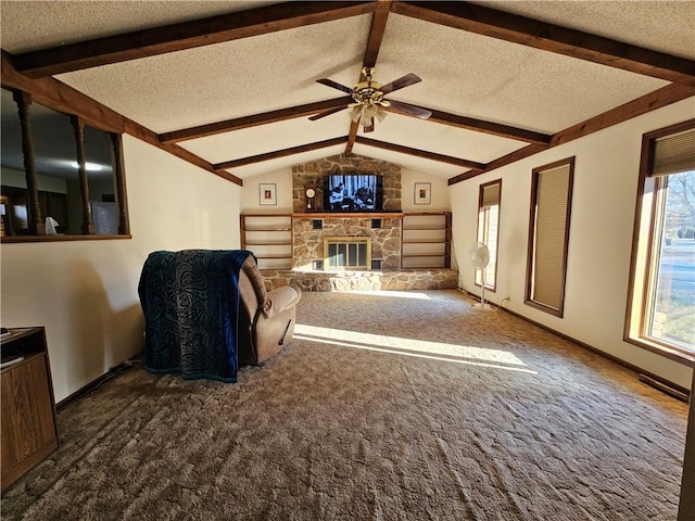 unfurnished living room with carpet, plenty of natural light, a textured ceiling, and lofted ceiling with beams