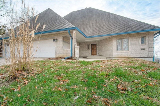 back of property with a garage