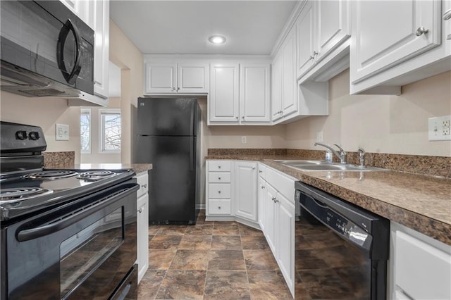 kitchen featuring sink, white cabinets, and black appliances