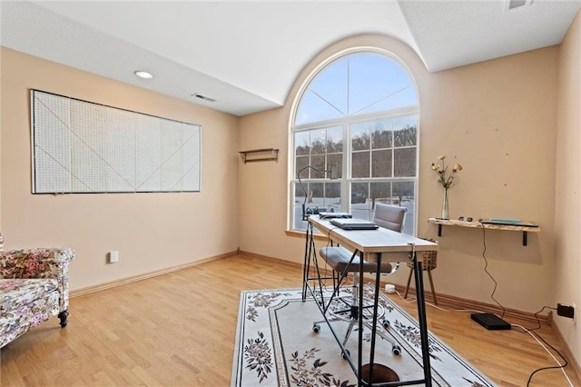 office space with light wood-type flooring